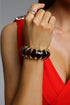 Myra Segmented Amber Resin and Metal Red Bangle